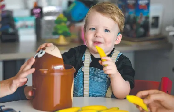  ?? ?? Teddy Dickinson, 17 months, at Hear and See at James Cook University. Pictures: Evan Morgan