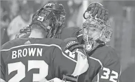  ?? Mark J. Terrill Associated Press ?? GOALIE JONATHAN QUICK and forward Dustin Brown, celebratin­g a victory over Toronto on Thursday, are two big reasons for the Kings’ 10-2-2 start.