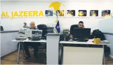  ?? (Ammar Awad/Reuters) ?? EMPLOYEES WORK in the Jerusalem office of Qatar’s Al Jazeera network on last week.