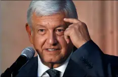  ??  ?? Mexico’s President-elect Andres Manuel Lopez Obrador speaks to reporters after meeting with Mexico’s President Enrique Pena Nieto at the National Palace in Mexico City, on Tuesday.