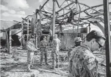  ?? New York Times file photo ?? U.S. troops survey the damage to a building on Jan. 13, 2020, at Ain al-Asad Air Base in Anbar, Iraq. The U.S. will announce a deadline to withdraw combat forces from Iraq by the end of 2021.