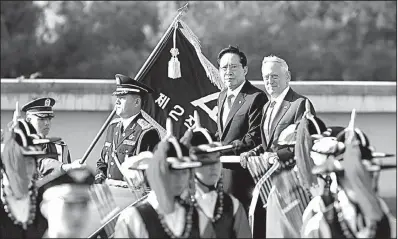  ?? AP/LEE JIN-MAN ?? Defense Secretary James Mattis joins South Korean Defense Minister Song Young-moo in inspecting an honor guard Saturday in Seoul. Mattis said that while diplomacy remains the preferred means of stopping North Korea’s nuclear program, “make no mistake —...