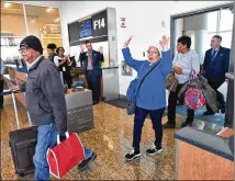  ?? HYOSUB SHIN / HSHIN@AJC.COM ?? Patricia Smith of New York reacts Thursday as one of JetBlue’s first fliers arriving at Hartsfield-Jackson Internatio­nal Airport from New York’s John F. Kennedy Internatio­nal Airport.