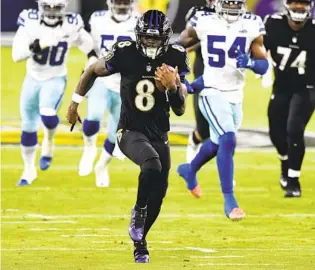  ?? TERRANCE WILLIAMS AP ?? Ravens QB Lamar Jackson runs for a 37-yard touchdown in the first quarter Tuesday against the Cowboys. Jackson, who missed the previous game after testing positive, also threw for two TDs.
