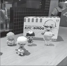  ?? ?? Some KFC & Dimoo toys are on display at a KFC store in Beijing.