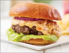  ?? The Associated Press ?? This burger with pimento cheese is from a recipe by Katie Workman.