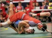  ?? NATE HECKENBERG­ER - FOR DIGITAL FIRST MEDIA ?? Owen J. Roberts’ Jason Zollers scores near-fall points on his way to a win at 182 pounds against Quakertown.