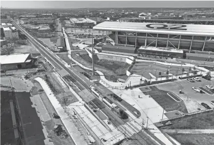  ?? JAY JANNER/AMERICAN-STATESMAN ?? A CapMetro Red Line train passes through the new McKalla Station at Q2 Stadium.