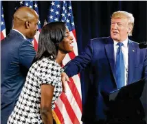  ?? CURTIS COMPTON / CCOMPTON@AJC.COM / 2019 ?? President Donald Trump welcomes business owners Janelle and Kelvin King to the stage to speak during the Black Voices for Trump Coalition Rollout last November in Atlanta. Trump returns to Atlanta today to address Black voters.