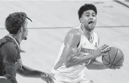  ?? Brett Coomer / Staff photograph­er ?? UH guard Quentin Grimes, right, began his career at Kansas and credits his growth into a more complete player to working with assistant Quannas White.