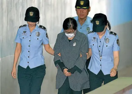  ?? PHOTO: REUTERS ?? Choi Soon-sil, a longtime friend of ousted president Park Geun-hye, arrives at a court in Seoul yesterday to be sentenced on corruption charges.