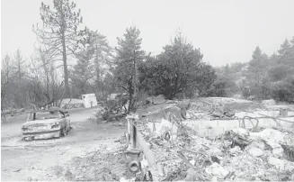  ?? John Ashbury/press Enterprise ?? A home in the Bonita Vista area near Idyllwild, Calif., was reduced to rubble after wildfires swept through Southern California. Authoritie­s have issued hundreds of evacuation orders.