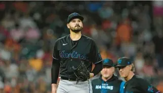  ?? DAVID J. PHILLIP/AP ?? Miami Marlins starting pitcher Pablo Lopez walks back to mound after being hit by a ball off the bat of the Houston Astros’ Michael Brantley during the fifth inning Friday.