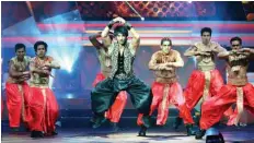  ??  ?? In this file photo taken on July 6, 2013 Indian Bolywood actor Sushant Singh Rajput (center) dances at the 14th Internatio­nal Indian Film Academy (IIFA) at The Venetian hotel in Macau.—AFP photos