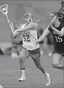  ?? SARAH GORDON/THE DAY ?? Old Lyme’s Sydney Cowell (32) makes a move during an April 22 game against Canton. Cowell and the Wildcats advanced to the Shoreline Conference title on Tuesday.