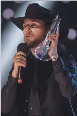  ??  ?? Brett Kissel accepts the award for Video of the Year at the Canadian Country Music Associatio­n Awards in Saskatoon, Sunday.