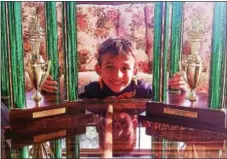  ?? SUBMITTED PHOTO ?? JJ Habres, 8, with his 2016 and 2017 World Pinewood Derby first-place trophies.