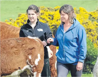  ?? Pictures: Ron Stephen. ?? Abbie and Audrey Anderson, at home with their Panmure herd.