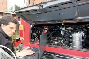  ??  ?? ABOVE: Rob confesses he’s a bit of a techie, so checking and controllin­g his VW’s engine via a laptop is music to his ears. CIRCLED: EMPI alloy sump holds an additional 3.5 litres of engine oil.