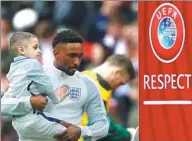  ?? DARREN STAPLES / REUTERS ?? Jermain Defoe with mascot Bradley Lowery, a terminally ill youngster, before England’s World Cup qualifying win over Lithuania on Sunday in London. Defoe scored to help England to a 2-0 victory.
