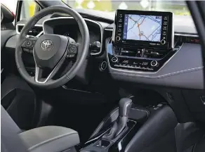  ??  ?? The 2019 Toyota Corolla Hatchback’s interior includes Apple CarPlay.