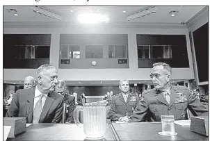  ?? AP/ANDREW HARNIK ?? Defense Secretary James Mattis (left) and Gen. Joseph Dunford, chairman of the Joint Chiefs of Staff, prepare to testify Tuesday before the Senate Armed Services Committee.