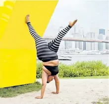  ?? CHRISTINE HEWITT/SUPPLIED PHOTO ?? Jessamyn Stanley, author of Every Body Yoga, performs a handstand.