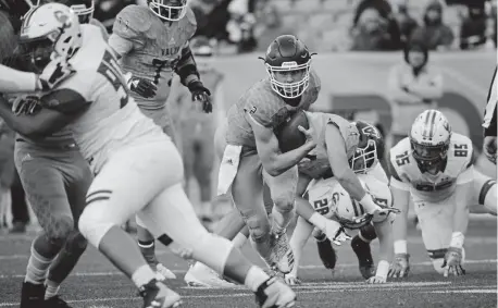  ?? Denver Post file ?? Valor Christian quarterbac­k Luke Mccaffrey scrambles for extra yards during the Class 5A football state championsh­ip game against Cherry Creek in December. Valor won 24-14. Mccaffrey will play for Nebraska in the fall.