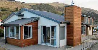  ?? DEAN KOZANIC/STUFF ?? As the house renovation­s were near completion, the home’s exterior was clad with western red cedar to replace the old New Zealand larch.