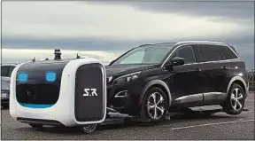  ??  ?? Le robot Stan est capable de soulever et garer une voiture.