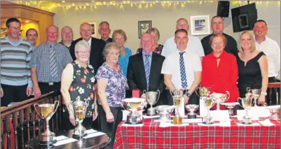  ??  ?? Stronvaar prize winners with their silverware: Jimmy Anderson and Shirley Bannatyne are flanking president Gavin McLachlan.