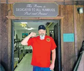  ?? Photograph­s by Hailey Branson-Potts Los Angeles Times ?? GENE “CHAINSAW” KOEN, who has served as a Clampers Humbug, poses outside the Frank C. Reilly Museum, a Clampers repository in La Porte, Calif.