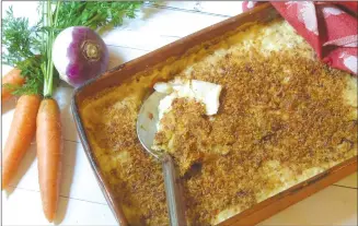  ?? Associated Press photo ?? This photo shows a root vegetable gratin made with turnips, carrots and parsnips.