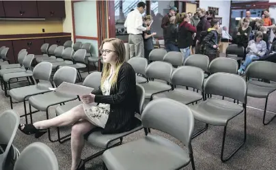  ??  ?? Moriah Engdahl waits for her turn to address the school board on the subject of arming teachers.