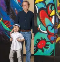  ?? Submitted photo ?? ■ Longhua Xu, right, and his grandson Han Xu, stand with artwork the two collaborat­ed on for an exhibit at the Mid-America Science Museum.