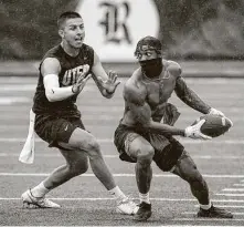  ?? Jon Shapley / Staff photograph­er ?? UTEP’s Isaiah Bravo, left, closes in on a teammate during some touch football after Saturday’s game with Rice was canceled.