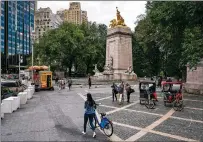  ?? KARSTEN MORAN/NEW YORK TIMES FILE PHOTO ?? Pedestrian­s and cyclists visit New York’s Central Park this month. New Yorkers say they fear the loss of outdoor spaces, where much of the city’s socializin­g has safely taken place, as the weather begins to cool.