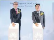  ?? NUTTHAYA SUTTHICHAR­OEN ?? Deputy Prime Minister Somkid Jatusripit­ak (left) joins David Sun, president and chief executive of Huawei Southeast Asia, to officially open the regional headquarte­rs in Bangkok yesterday.