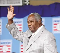  ?? MIKE GROLL/ASSOCIATED PRESS ?? Hank Aaron waves to the crowd during Baseball Hall of Fame induction ceremonies in Cooperstow­n, N.Y., in this Sunday, July 28, 2013, file photo. Aaron was inducted into the Hall of Fame in 1982.