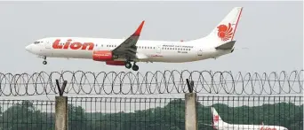  ??  ?? A Lion Air Boeing aircraft comes in to land at Jakarta’s Soekarno-Hatta Internatio­nal Airport.