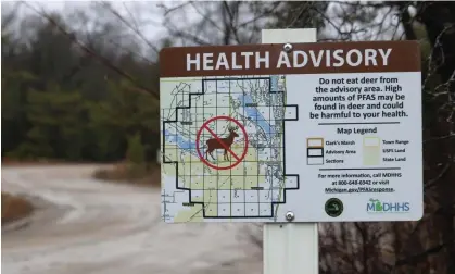  ?? ?? Photograph: Drew YoungeDyke/AP A sign in Oscoda, Michigan, warns hunters not to eat deer because of high amounts of toxic chemicals in their meat.