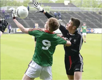  ??  ?? Sligo’s Gavin Gorman and John Gallagher of Mayo in a tussle. Pics: Tom Callanan.