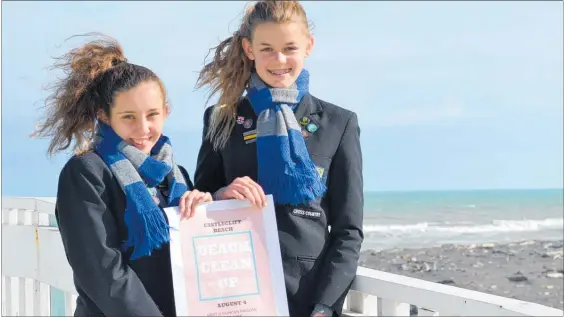  ?? PICTURE / PAUL BROOKS ?? Paige Stead (left) and Ruby Musson are out to clean the beach.