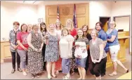  ?? COURTESY PHOTO ?? The McDonald County Courthouse staff is pictured with a trophy they won for raising the most food items for Crosslines. Arvest Bank got business partners involved with their efforts to raise food items for the charity this year.