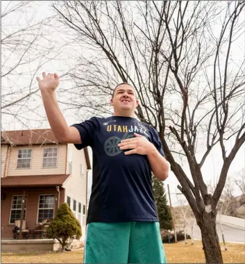  ?? Photo by Steve Gray ?? Brandon Baker continues to be a friend to countless strangers as he greets them outside his home in Payson with a smile and a wave.