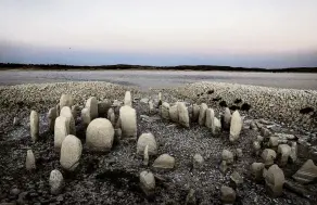  ?? PHOTO: REUTERS ?? The dolmen of Guadalpera­l, also known as the Spanish Stonehenge, is visible due to the receding waters of the Valdecanas reservoir in the outskirts of El Gordo, Spain.