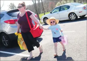  ?? Ernest A. Brown photo ?? Tracey Wilhelmsen, of Cumberland, arrives for a fun day at the beach with her daughter Olivia, 3, at Stephen Olney Pond in Lincoln Woods State Park in Lincoln Wednesday.