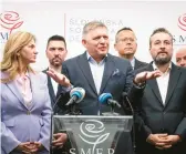  ?? VLADIMIR SIMICEK/GETTY-AFP ?? Chairman of Smer-Social Democracy party Robert Fico, center, addresses a news conference Sunday after the election in Bratislava, Slovakia.