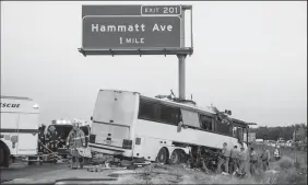  ?? MERCED SUN-STAR FILE PHOTOGRAPH­S BY ANDREW KUHN ?? Rescue crews respond to the scene of a charter bus crash on northbound Highway 99 between Atwater and Livingston on Aug. 2, 2016. According to the California Highway Patrol, the bus carrying about 30 people struck a large pole holding the highway exit...