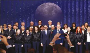  ?? (Reuters) ?? European Space Agency General Director Josef Aschbacher poses with members of its new class of astronauts during the European Space Agency Council at Ministeria­l level (CM22) at the Grand Palais Ephemere in Paris yesterday.